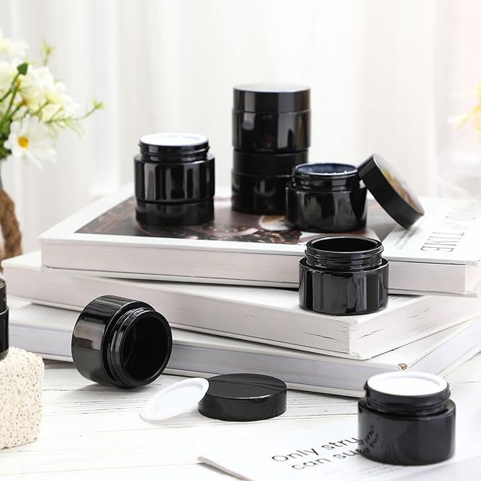 Domensi 100 Pcs 1 oz Glass Jars with Lids Bulk Round Glass Cosmetic Jars for DIY Lip Balm Small Travel Containers with Inner Liner for Lotions Powders Ointments Sample Cream(Black,Black)